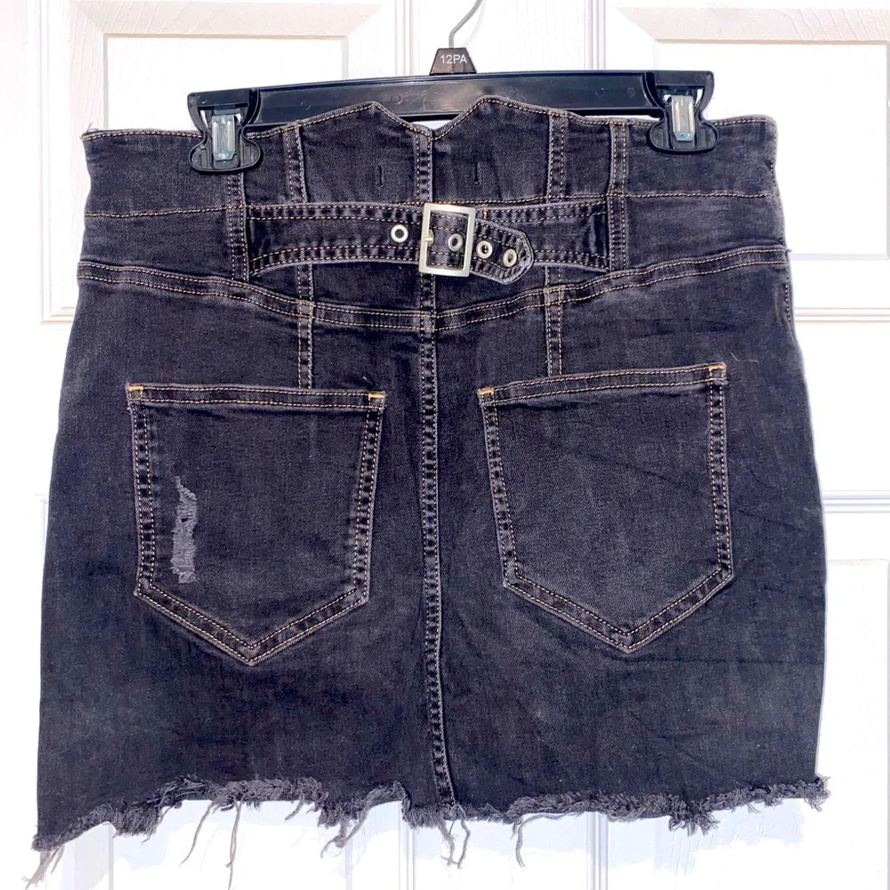 Free People distressed denim black mini skirt. Size 8
